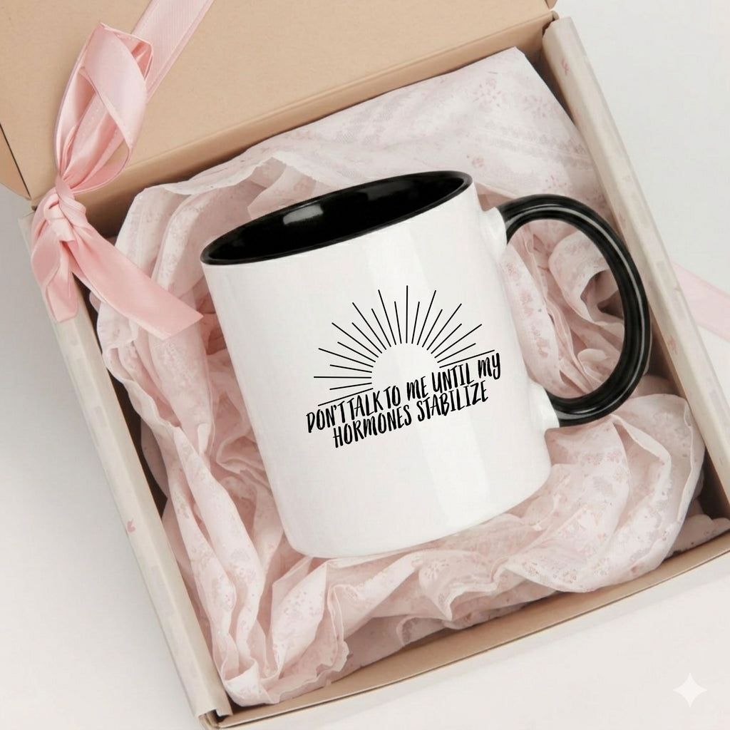 Black accent funny perimenopause mug with hormone humor design, in a gift box for women experiencing menopause or mood swings